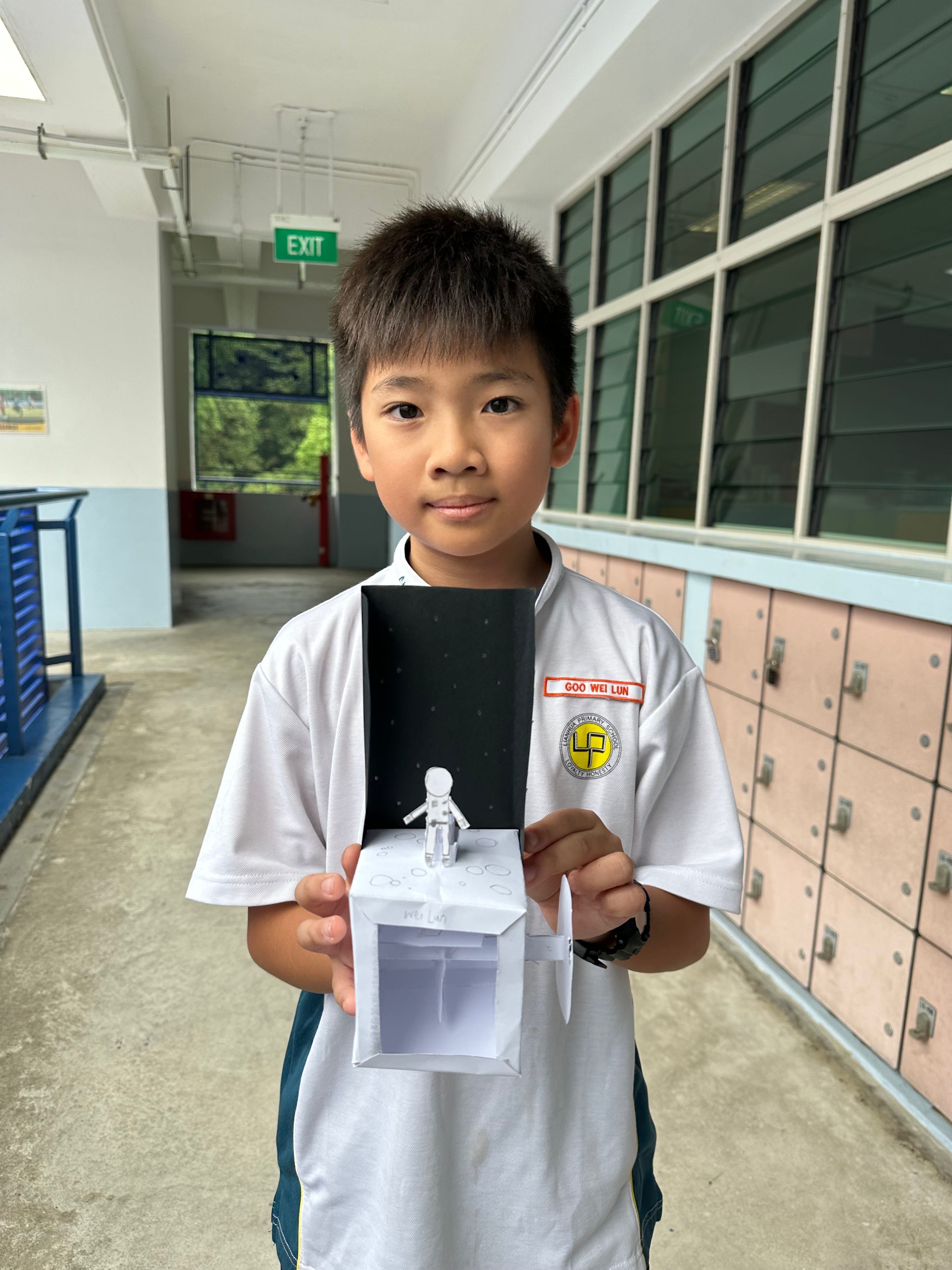 Boy with his experiment work.